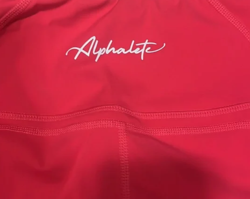 Alphalete pulse surge leggings in color Coral womens size S /RG3/120